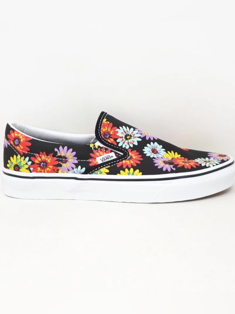Vans Classic Slip-On Sneakers in Black with Multicolor Peace Floral Print